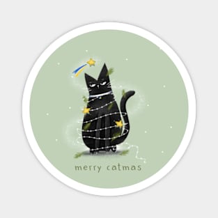 Cartoon black cat in New Year's garlands and the inscription "Merry Catmas". Magnet